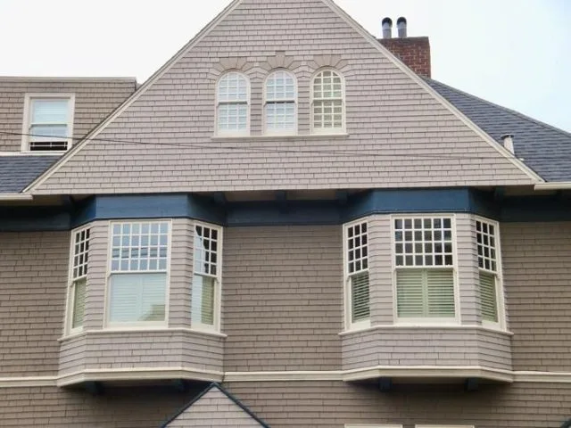 A residential building with energy-efficient windows, highlighting sustainable designs offered by Save Energy Company in Petaluma.