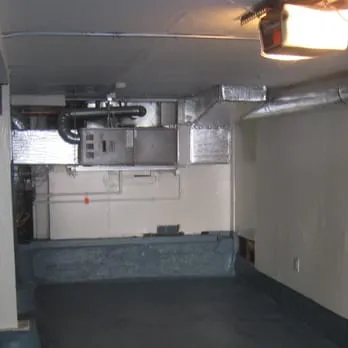 A professional duct system installation in a basement by Schmitt Heating Company, Inc. in San Francisco.