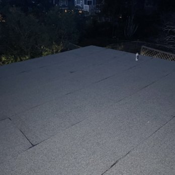 A flat, newly installed roof viewed at dusk, showcasing the work of Sersiv Roofing Corporation in Sunnyvale.