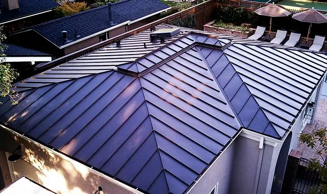 "Aerial view of a residential building with a sleek, modern metal roof installed by Shelton Roofing Co., Inc. in Mountain View."