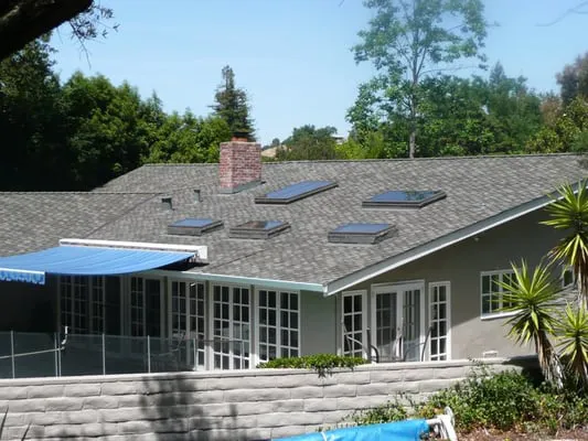 "A well-maintained residential roof in San Jose with skylights, expertly installed by Simon Says Roofing."