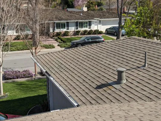 Rooftop view of a residential neighborhood in San Jose featuring precisely aligned shingles, showcasing the craftsmanship of Simon Says Roofing.