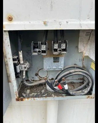 An open electrical panel in need of maintenance, displaying exposed wires and connectors, showcasing Skylight Electrical Service's commitment to precise and effective repairs in Fairfield.
