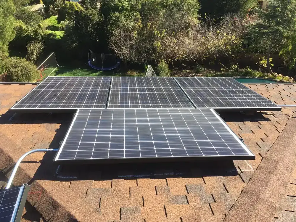 Solar panels installed on a rooftop in a sunny, green residential area, illustrating SolarUnion's renewable energy efforts in San Francisco.