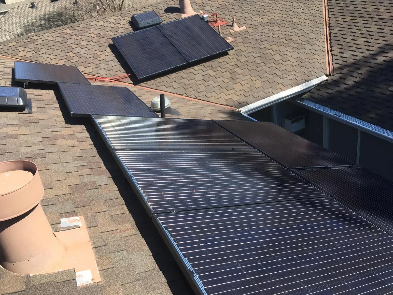 "A rooftop with multiple solar panels installed by SolarUnion, capturing sunlight for energy in San Francisco."