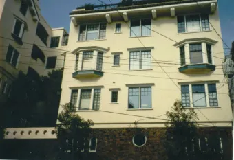 A view of a multi-story building with fresh paint and detailed architecture, showcasing the work of Solidarity Painting, Inc. in Santa Rosa.