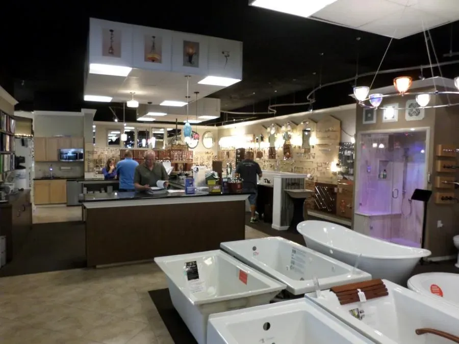 Interior of SplashWorks showroom in San Jose featuring various bathtubs and lighting fixtures on display.