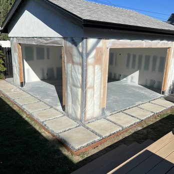 A garage with freshly installed drywall by Sulvaran Drywall, showcasing clean and precise construction in Antioch.