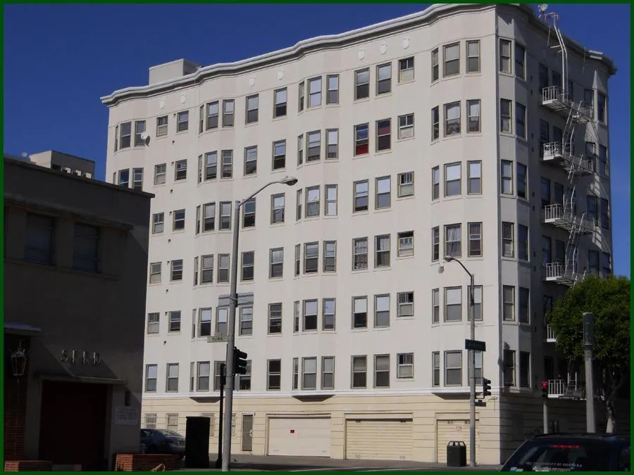 A multi-story residential building in San Francisco, painted with a light, neutral color, showcasing Tara Pro Painting, Inc.'s professional work.