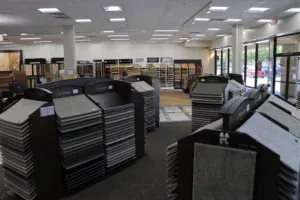 Interior of The Floor Store in Richmond, showing various flooring samples displayed on racks within a well-lit showroom.