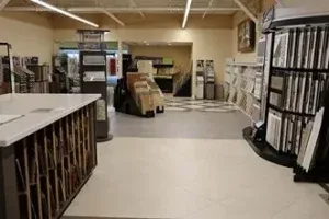 Interior view of The Floor Store in Richmond showcasing a variety of flooring samples, including tiles and hardwood, displayed in an organized layout.