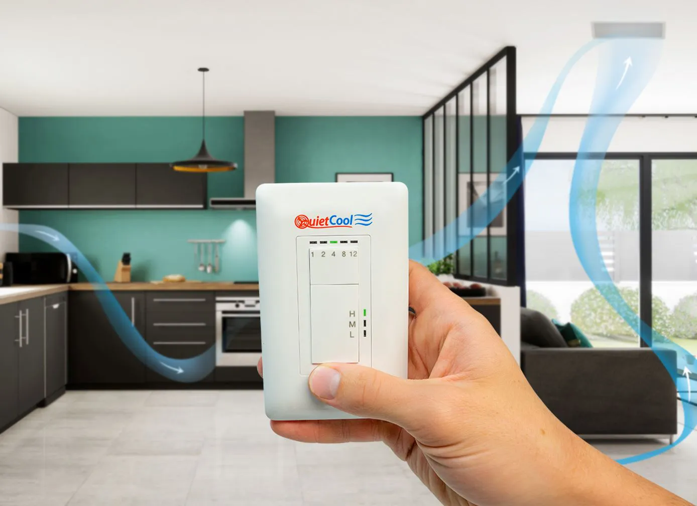 A hand holds a QuietCool fan controller in a modern, open-concept home, illustrating airflow through the living spaces.