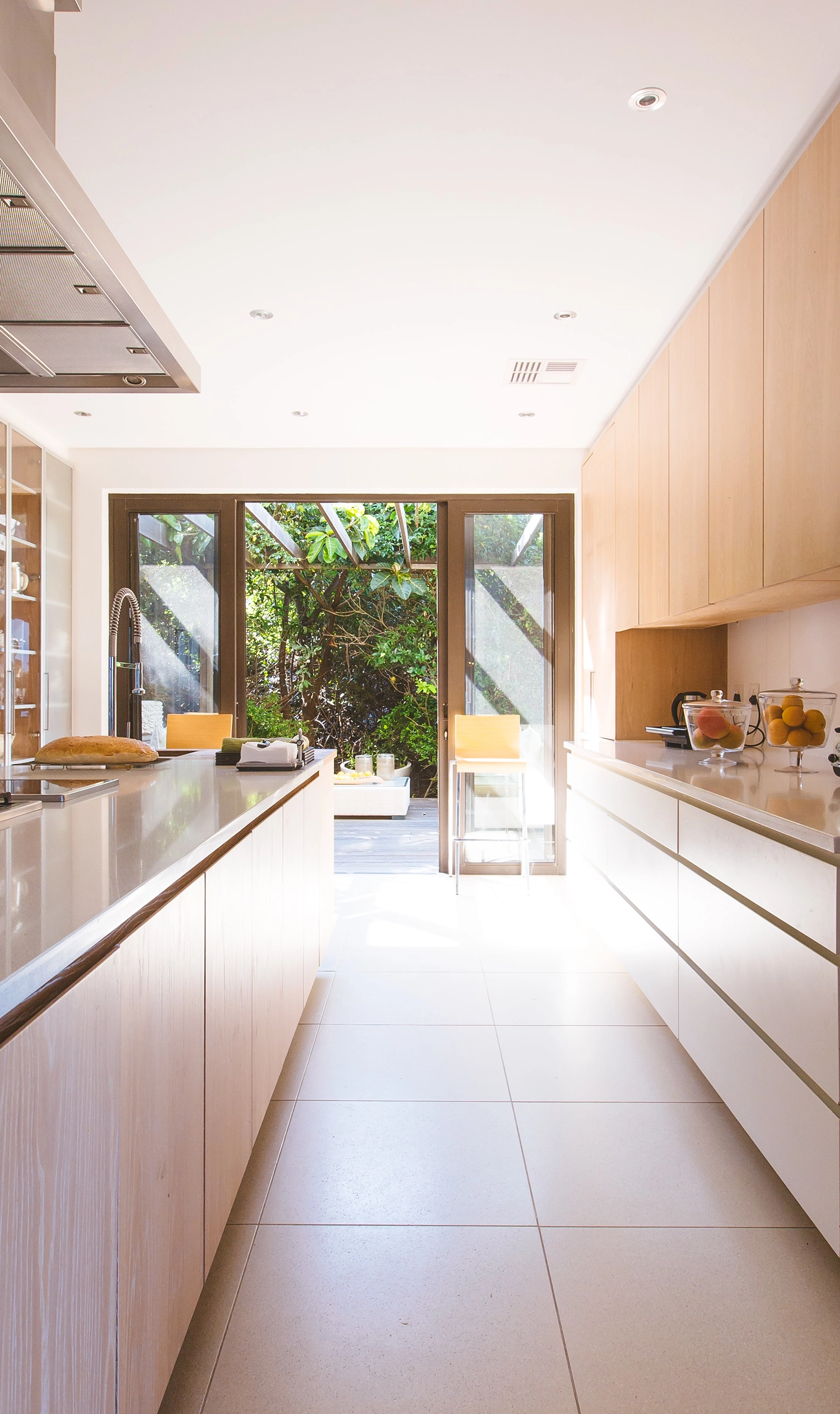 Modern kitchen interior featuring sleek wooden cabinetry and a bright, open design by Wise Builders Remodeling, Inc. in San Francisco.