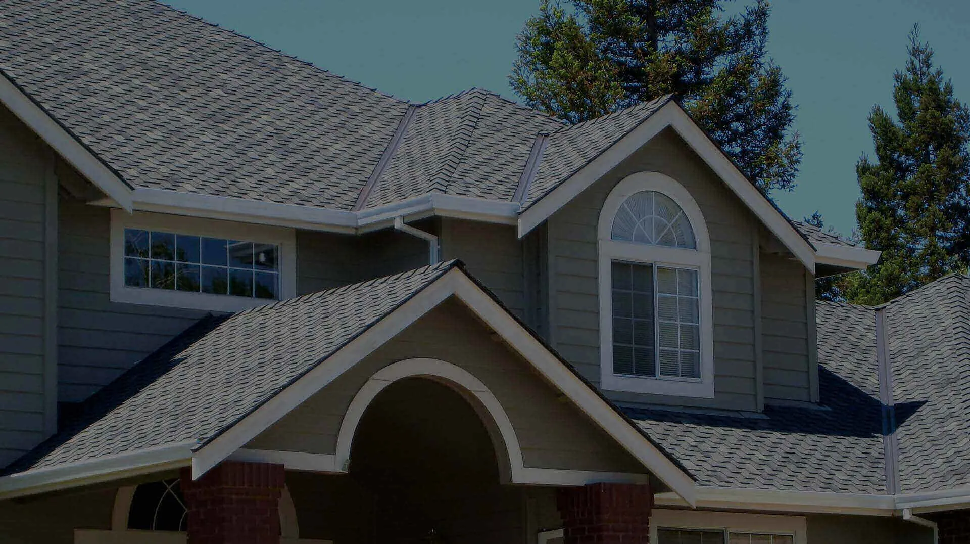 The image depicts a well-maintained residential roof featuring a complex architectural design and high-quality shingles, installed by Yorkshire Roofing of Northern California Inc. DBA Roofmax, located in Livermore.